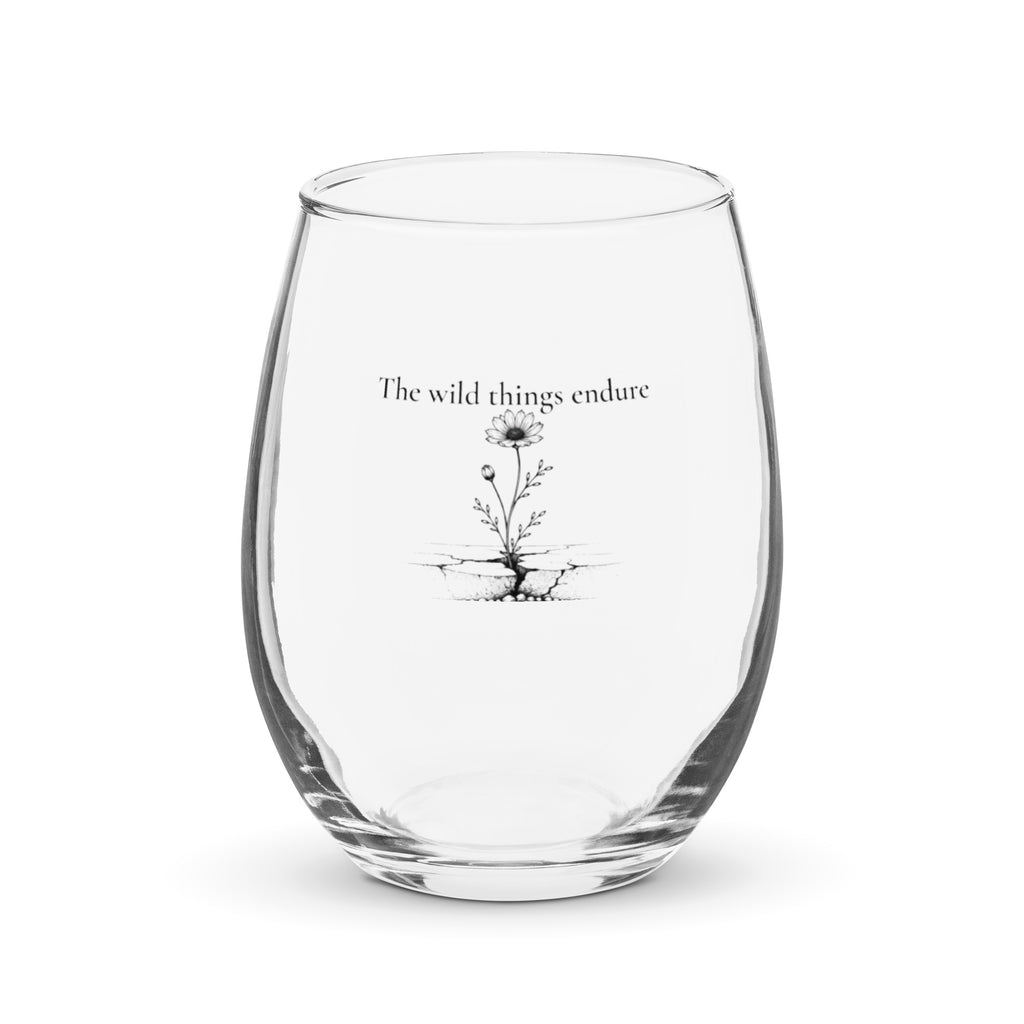 Clear glass tumbler with black floral design and text on a white background